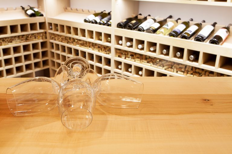 Empty wine glasses in wine rack